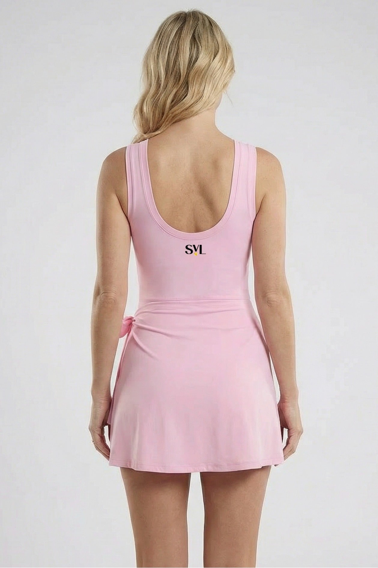Back view of SVL pink padel and tennis dress Play and Party athletic performance dress for women