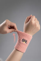 Close-up of SVL pink padel and tennis wristband showing stretch and absorbent fabric