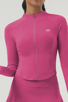 Close-up front view of the dark pink Swan Sway performance jacket featuring a full-length zipper, high collar, and SVL logo.