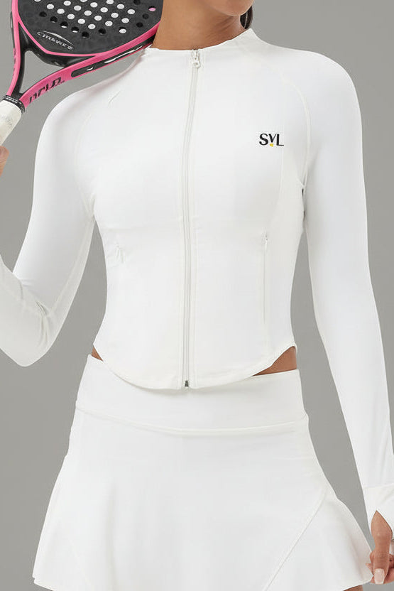Front view of a woman wearing the white Swan Sway performance jacket with a matching white athletic skirt for tennis and padel.