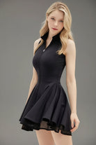 Front studio shot of the black Wiktoria athletic dress highlighting the elegant flared double-layered skirt and fitted athletic bodice.