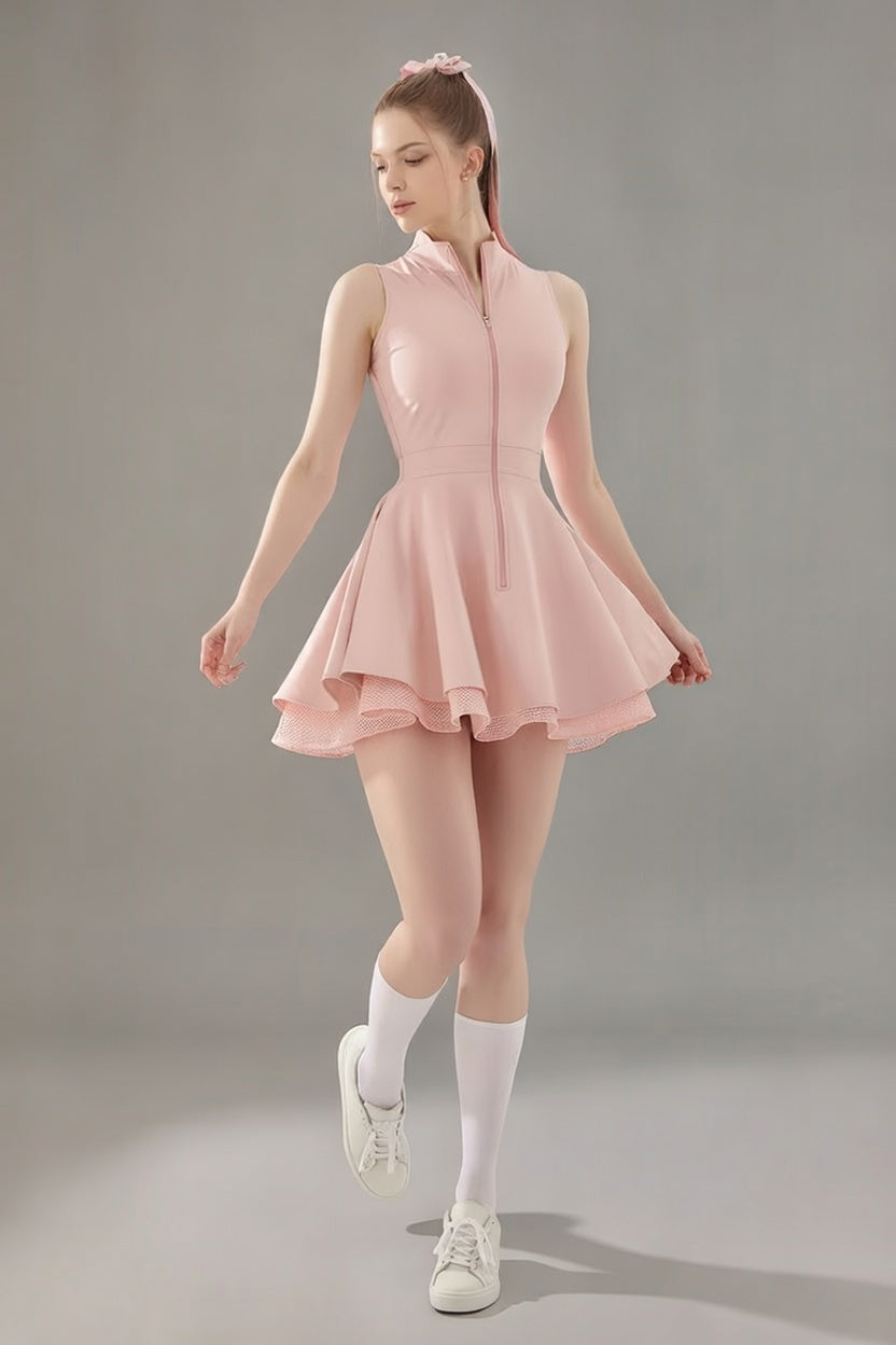 Full-length studio shot of the pink Wiktoria performance dress highlighting the elegant flared silhouette and breathable mesh trim on the skirt.